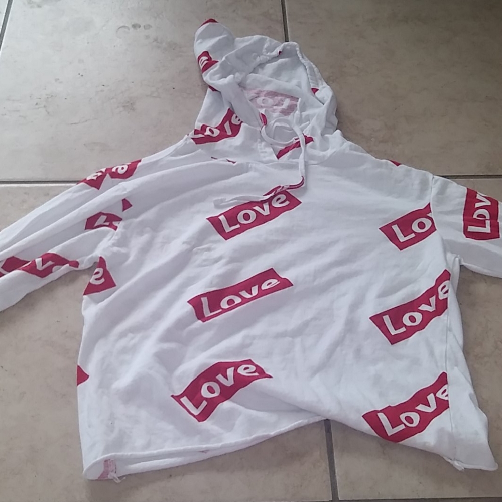 Long sleeve white crop top says love